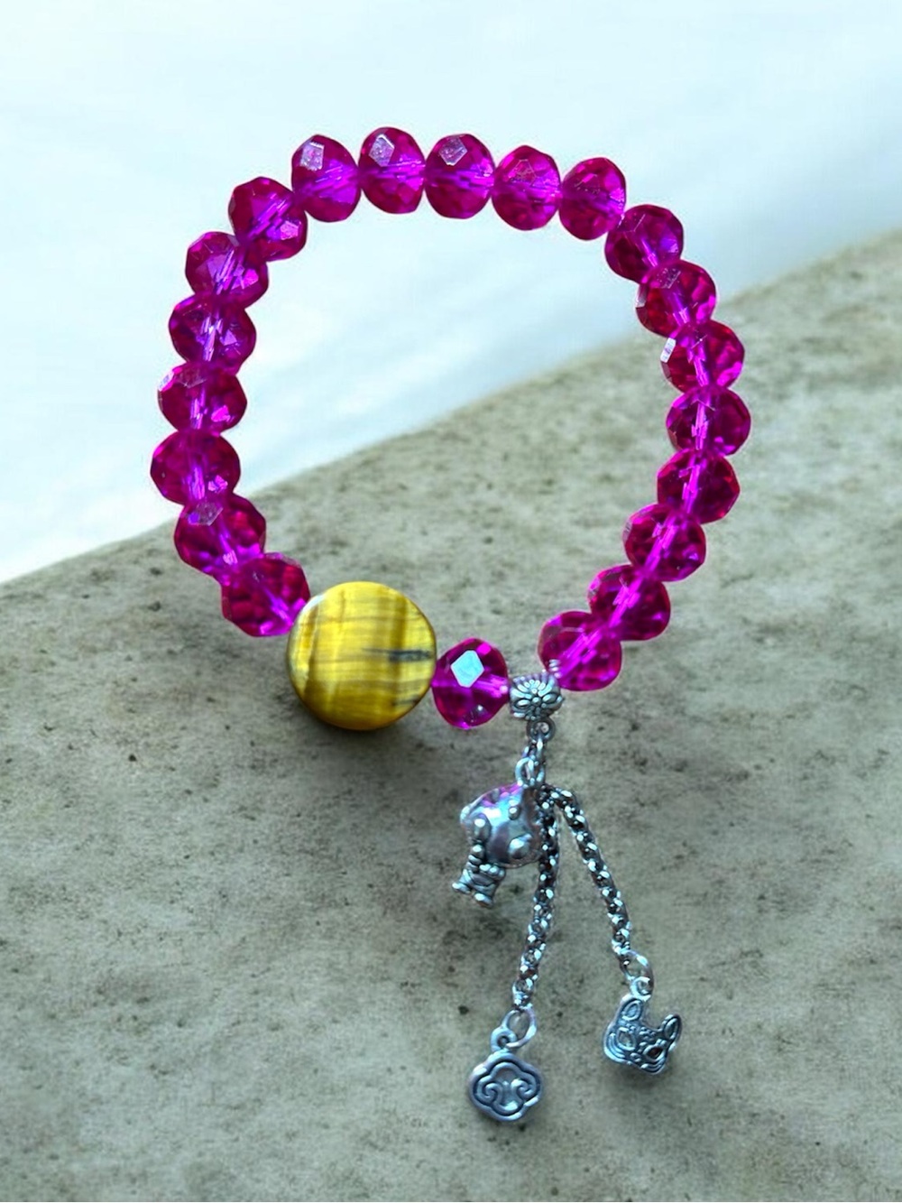 # 1.  Vibrant Pink Agate 10mm Bracelet with Tiger Eye Accent and Silver Charm